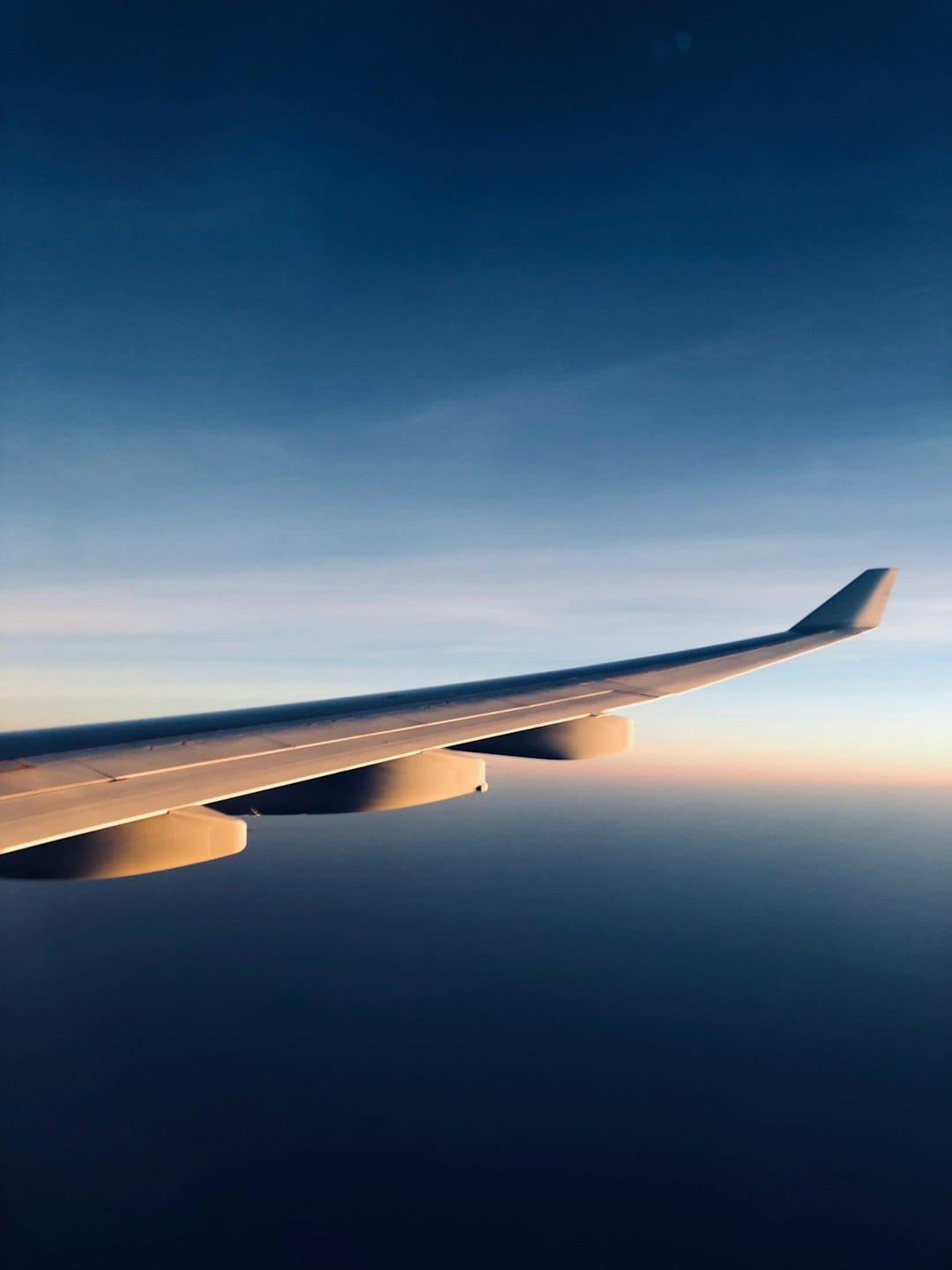 timelapse photo of white plane wing qgz8fu imla